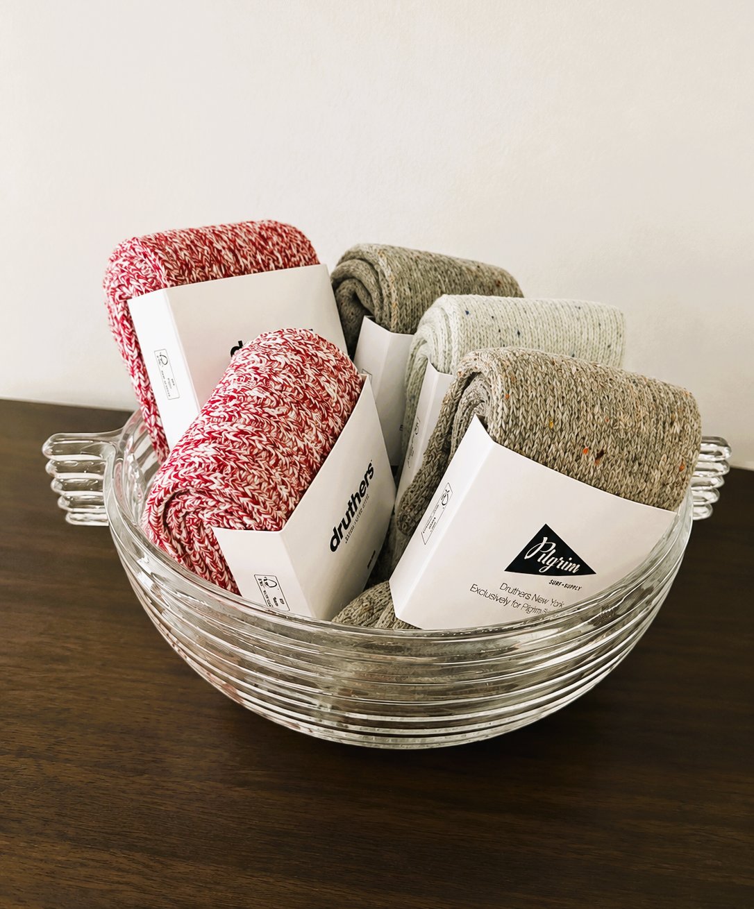 Druthers wool socks in a glass bowl