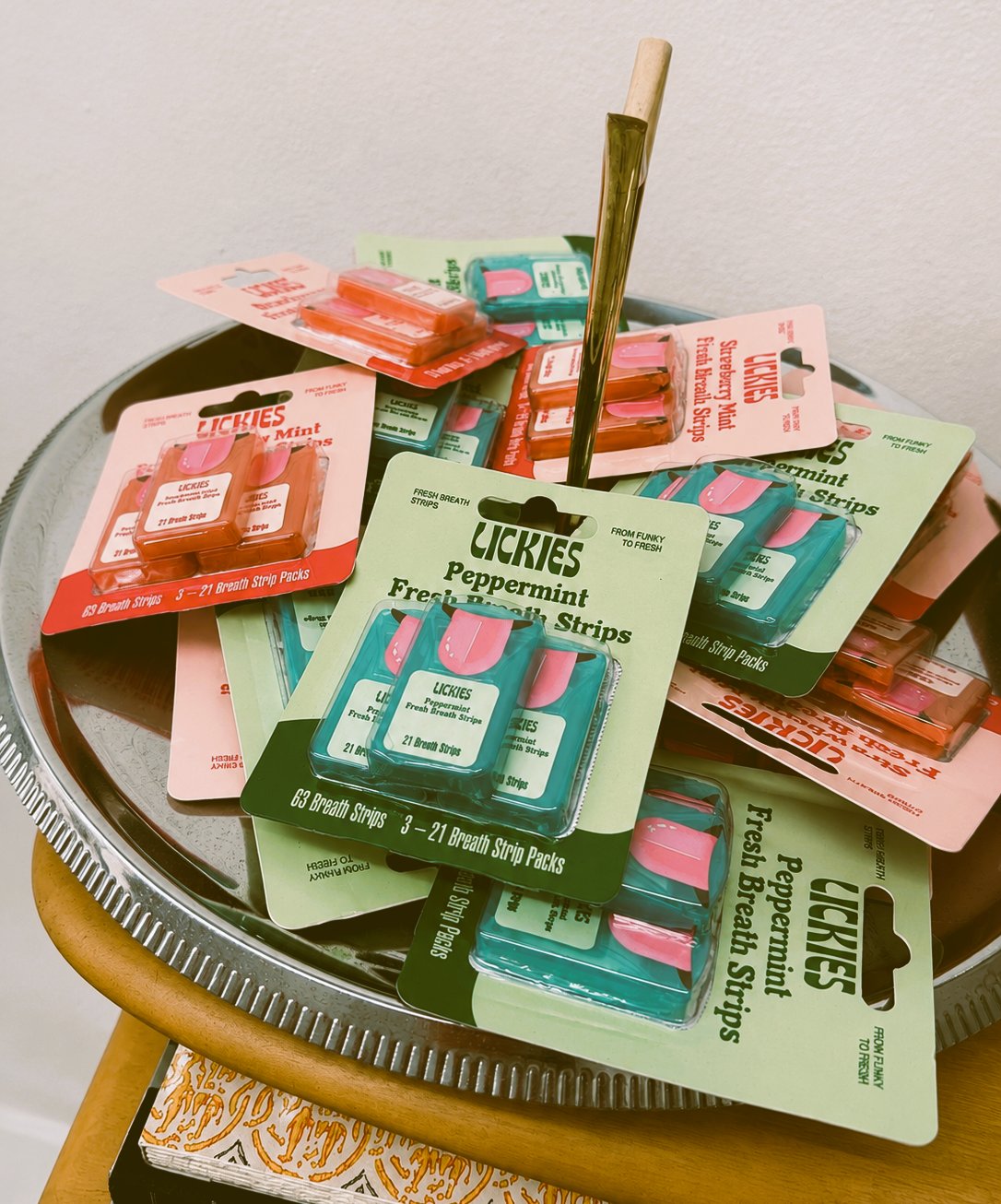 Lickies breath strips in peppermint and strawberry mint packaging