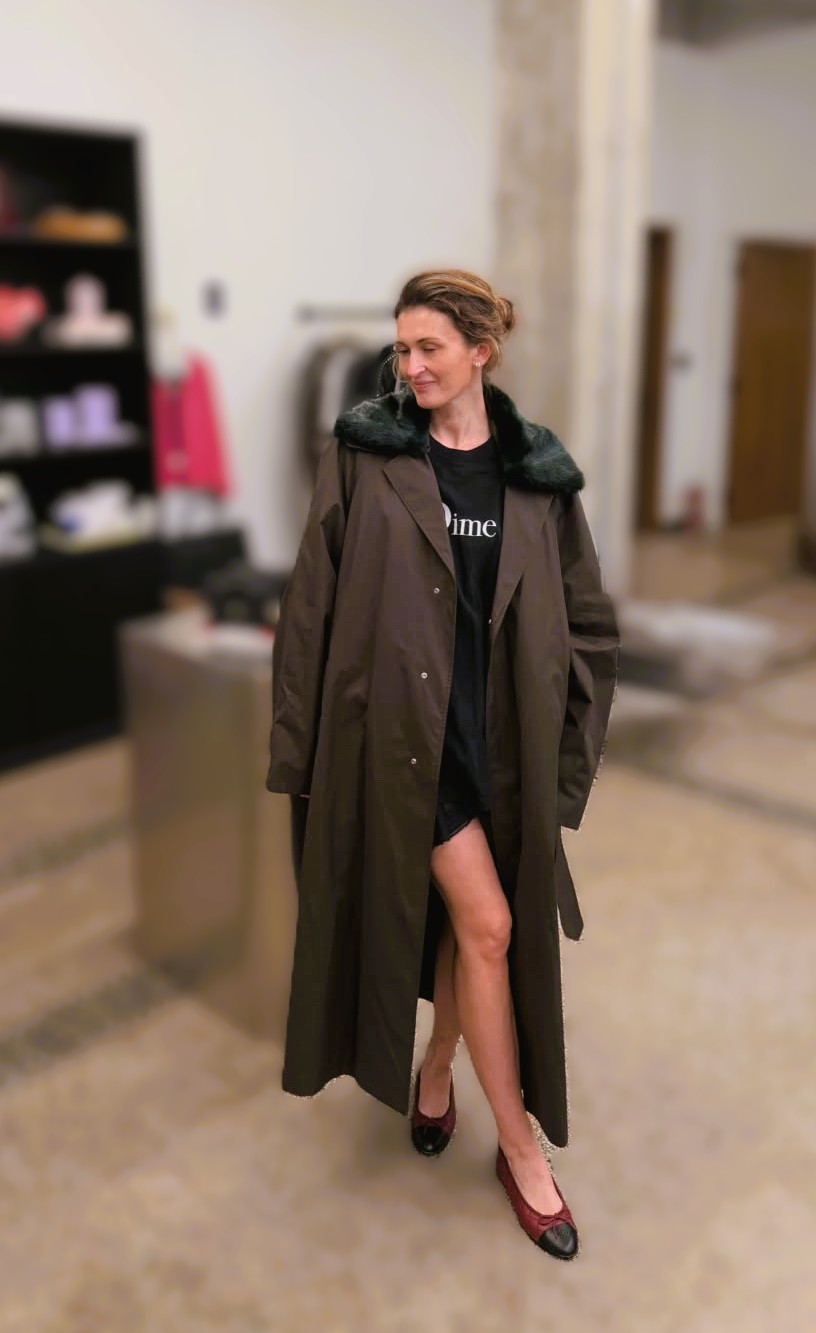 Long dark coat, shot inside the shop